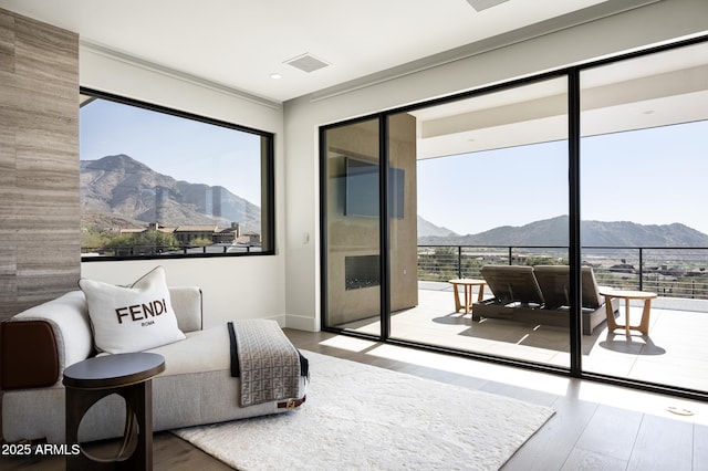 interior space with a mountain view and multiple windows