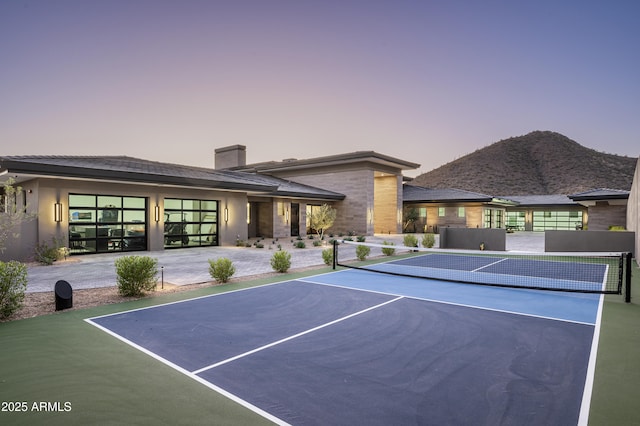 view of tennis court with basketball court