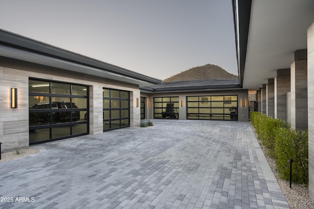 property exterior at dusk with a garage