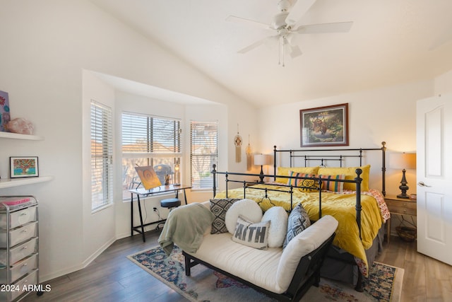 bedroom featuring ceiling fan, wood-type flooring, and vaulted ceiling