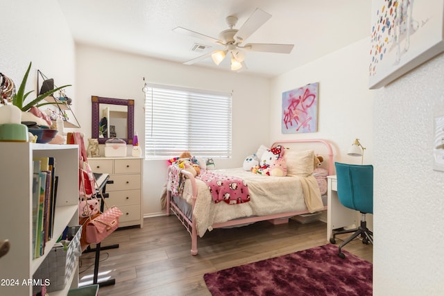 bedroom with ceiling fan and wood-type flooring