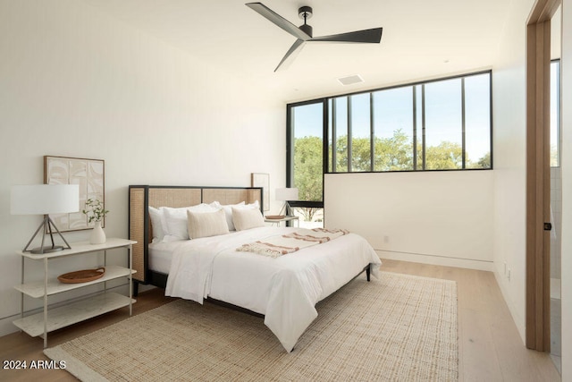 bedroom featuring ceiling fan and light wood-type flooring