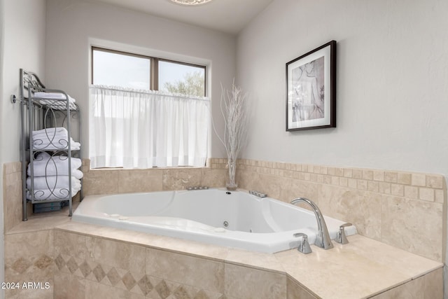 bathroom featuring a relaxing tiled tub