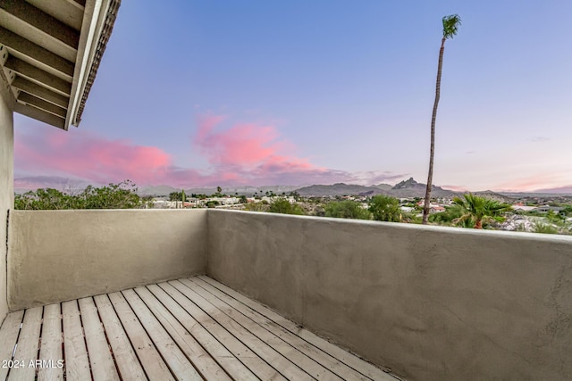 balcony at dusk with a mountain view