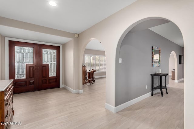 foyer entrance with light wood-type flooring