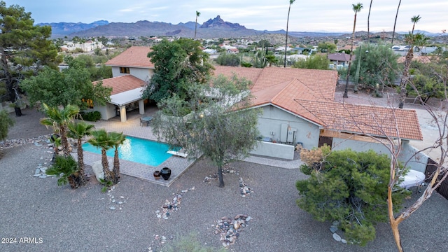 birds eye view of property with a mountain view