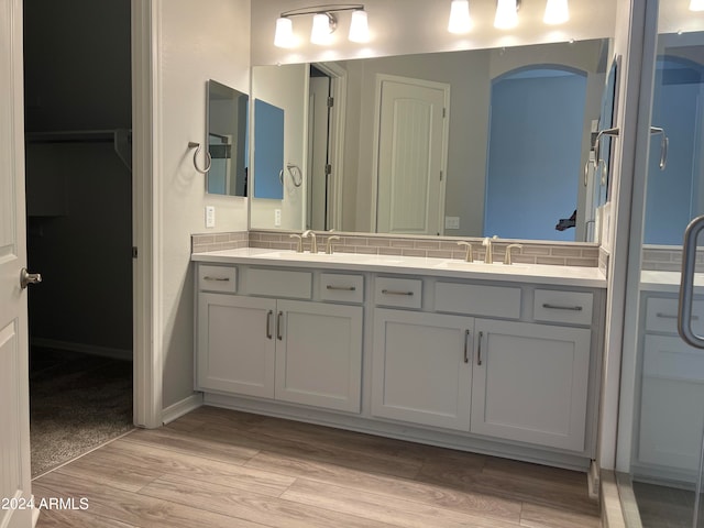 bathroom with wood-type flooring and vanity