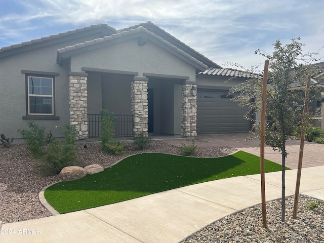 view of front of property with a garage