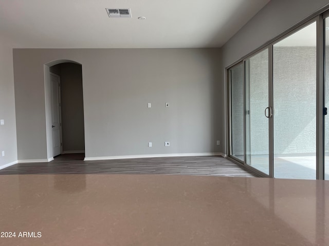 spare room featuring hardwood / wood-style floors