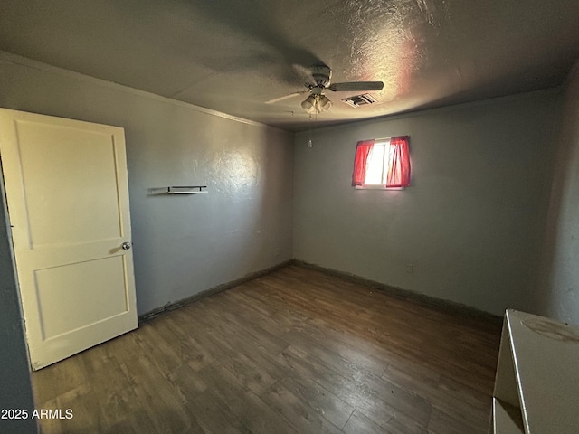 1816 N 38th Dr, Phoenix, AZ 85009 - spare room with ceiling fan, wood finished floors, baseboards, a textured ceiling, and ornamental molding