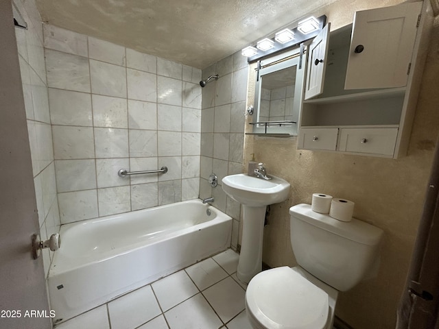 1816 N 38th Dr, Phoenix, AZ 85009 - bathroom with toilet, bathtub / shower combination, tile patterned floors, and tile walls