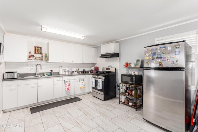 5044 N 18th Ave, Phoenix, AZ 85015 - kitchen with stainless steel appliances, under cabinet range hood, backsplash, and white cabinets
