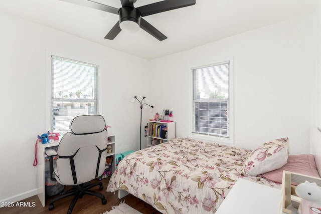 5044 N 18th Ave, Phoenix, AZ 85015 - bedroom featuring wood finished floors and a ceiling fan