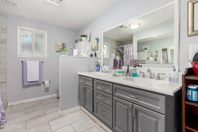 5044 N 18th Ave, Phoenix, AZ 85015 - full bathroom featuring double vanity and a shower with shower curtain