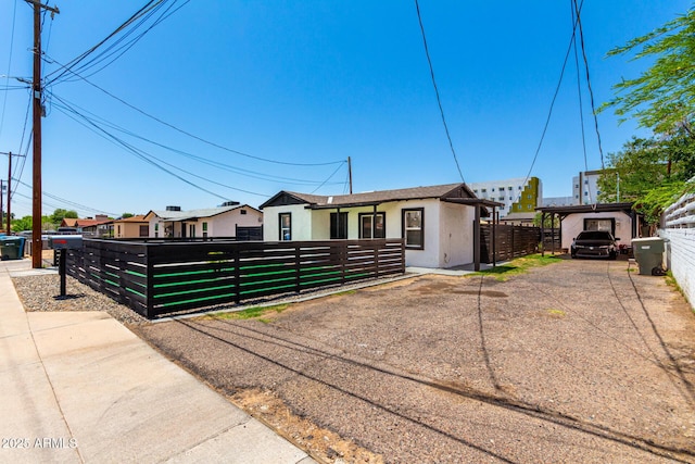 5044 N 18th Ave, Phoenix, AZ 85015 - ranch-style home with a fenced front yard, stucco siding, and a gate