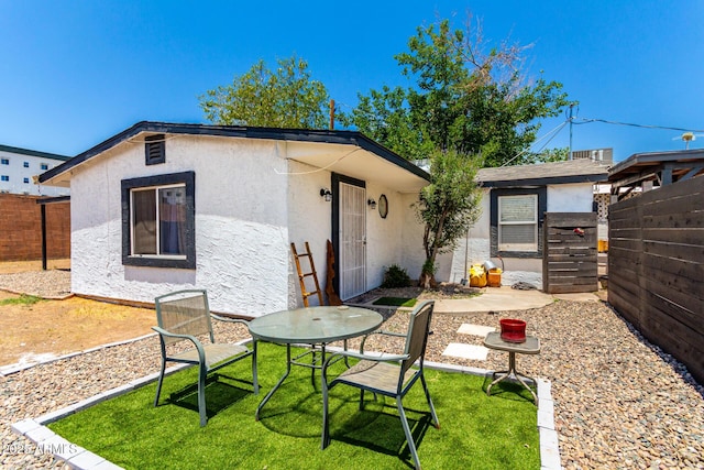 5044 N 18th Ave, Phoenix, AZ 85015 - rear view of house with stucco siding and a patio area