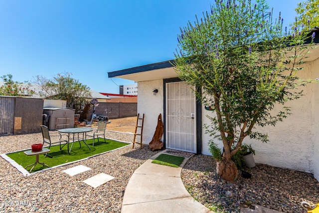 5044 N 18th Ave, Phoenix, AZ 85015 - view of exterior entry with stucco siding and a patio area