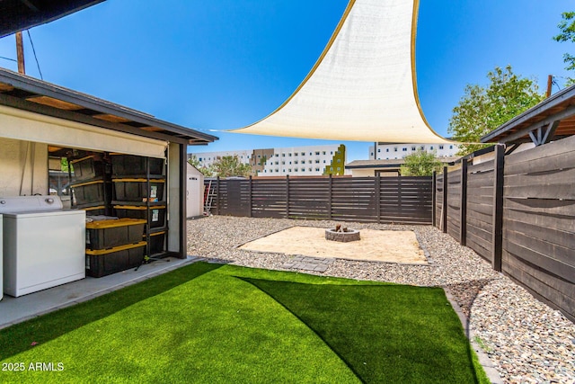 5044 N 18th Ave, Phoenix, AZ 85015 - fenced backyard featuring washer / clothes dryer and a fire pit