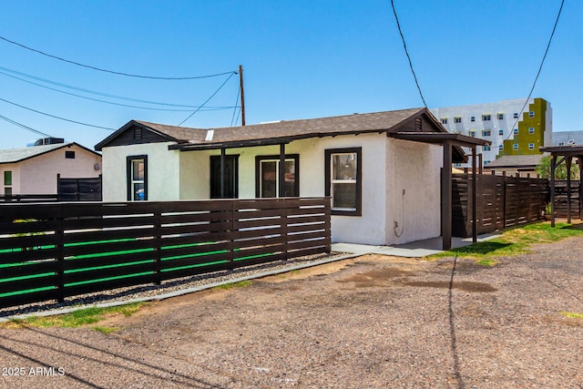 5044 N 18th Ave, Phoenix, AZ 85015 - view of front of property with stucco siding and a shingled roof