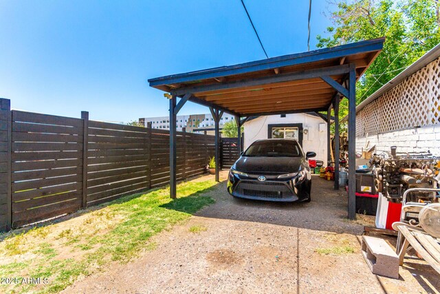 5044 N 18th Ave, Phoenix, AZ 85015 - view of car parking with a carport and driveway
