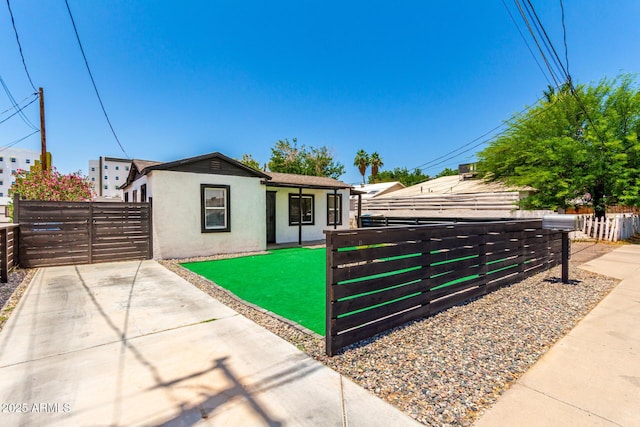 5044 N 18th Ave, Phoenix, AZ 85015 - view of front of property with stucco siding and a gate