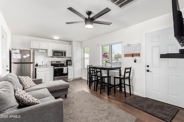 5044 N 18th Ave, Phoenix, AZ 85015 - living room with ceiling fan and wood finished floors