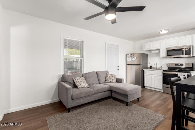5044 N 18th Ave, Phoenix, AZ 85015 - living room featuring ceiling fan and dark wood-style floors