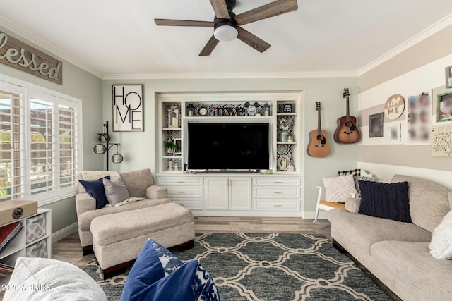 597 S 221st Dr, Buckeye, AZ 85326 - living room featuring a ceiling fan, crown molding, light wood finished floors, and baseboards