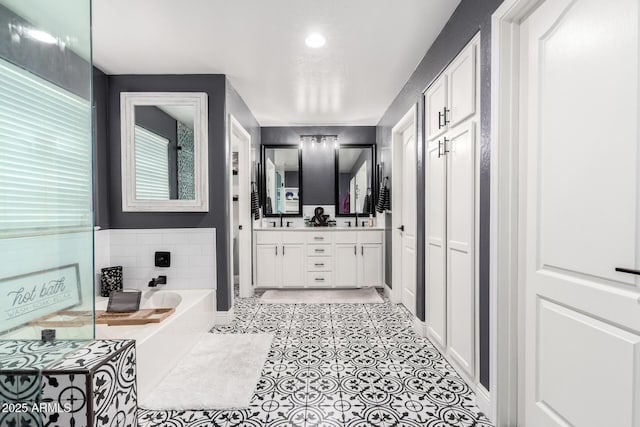 597 S 221st Dr, Buckeye, AZ 85326 - bathroom featuring a bath and double vanity