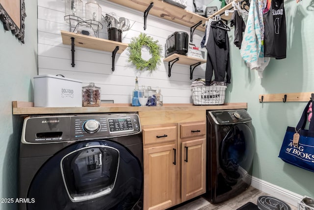 597 S 221st Dr, Buckeye, AZ 85326 - laundry room with washer / dryer, baseboards, and cabinet space