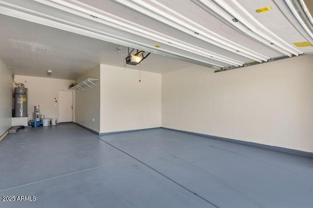 597 S 221st Dr, Buckeye, AZ 85326 - garage with water heater, a garage door opener, and baseboards