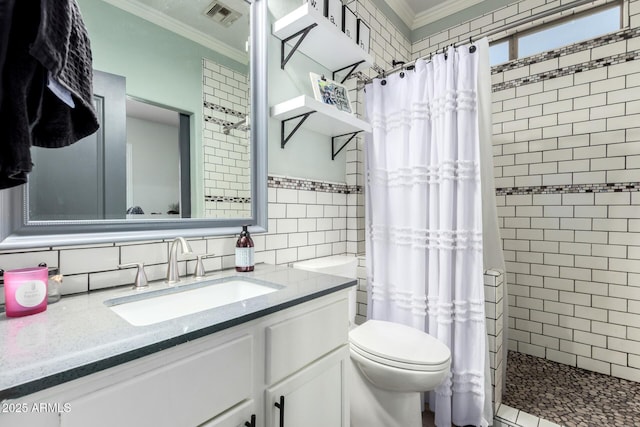 597 S 221st Dr, Buckeye, AZ 85326 - bathroom with tile walls, ornamental molding, tiled shower, vanity, and toilet