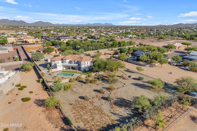 birds eye view of property with a mountain view