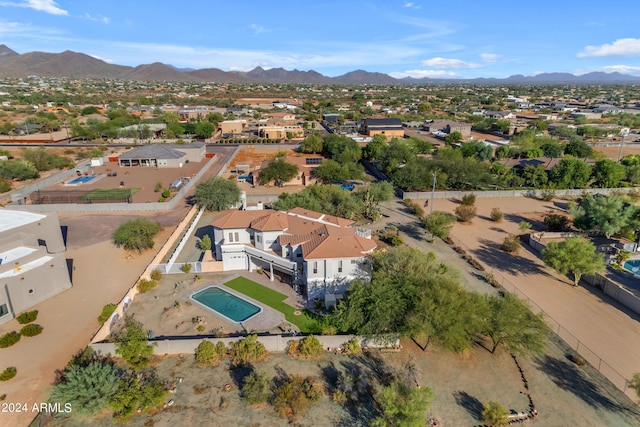 birds eye view of property with a mountain view