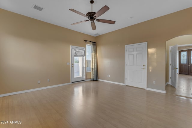 spare room with ceiling fan and light hardwood / wood-style floors