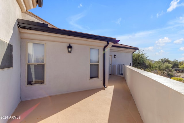 view of property exterior with a balcony