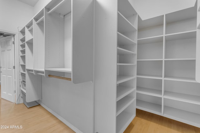 walk in closet featuring hardwood / wood-style flooring