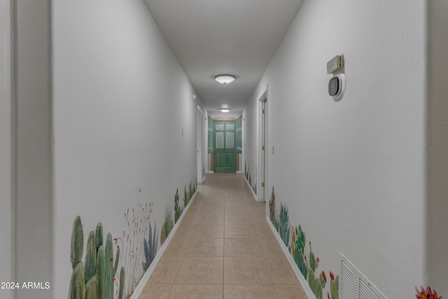 hallway featuring light tile patterned floors