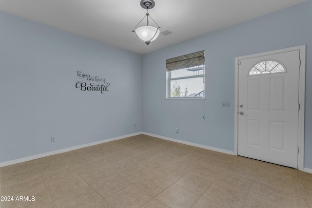 entryway with light tile patterned floors