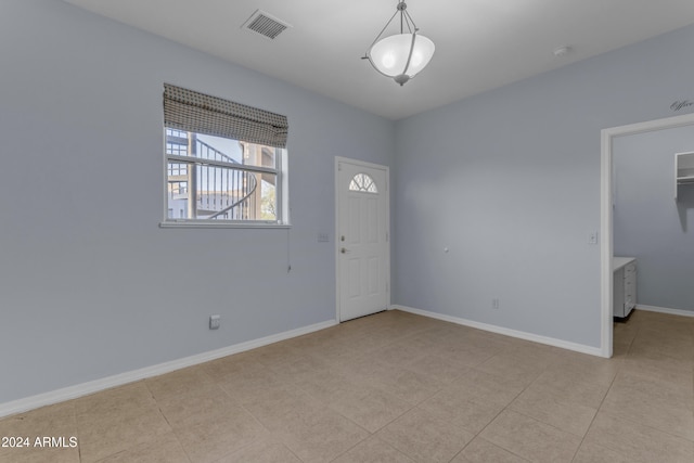 view of tiled spare room