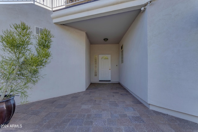 entrance to property featuring a balcony