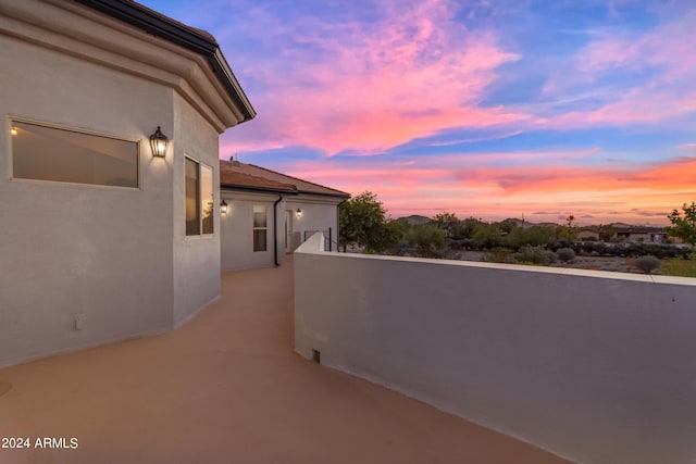 view of balcony at dusk