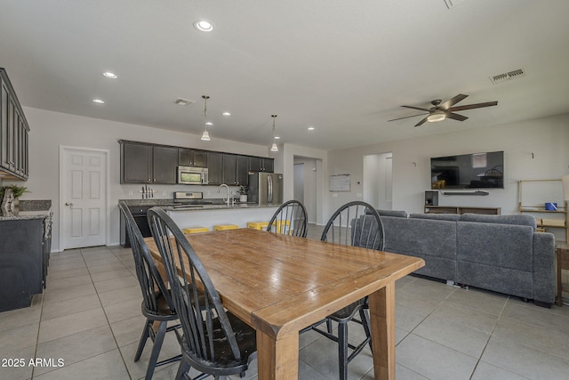 22463 E Desert Spoon Dr, Queen Creek, AZ 85142 - dining room with light tile patterned floors, recessed lighting, and a ceiling fan