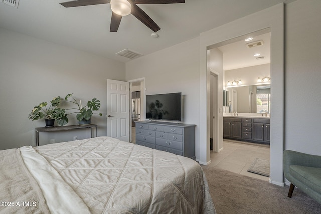 22463 E Desert Spoon Dr, Queen Creek, AZ 85142 - bedroom with light carpet, ensuite bath, light tile patterned flooring, ceiling fan, and baseboards