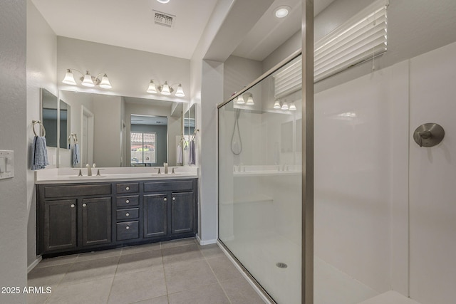 22463 E Desert Spoon Dr, Queen Creek, AZ 85142 - bathroom featuring walk in shower, tile patterned floors, double vanity, and baseboards