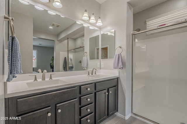 22463 E Desert Spoon Dr, Queen Creek, AZ 85142 - bathroom featuring a shower stall, double vanity, and tile patterned floors