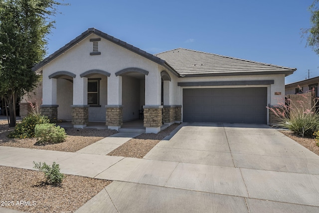 22463 E Desert Spoon Dr, Queen Creek, AZ 85142 - view of front of home with stucco siding, a garage, concrete driveway, and stone siding