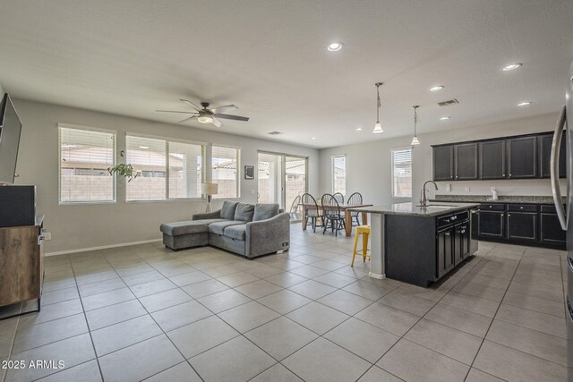 22463 E Desert Spoon Dr, Queen Creek, AZ 85142 - living room featuring baseboards, a ceiling fan, recessed lighting, and light tile patterned floors