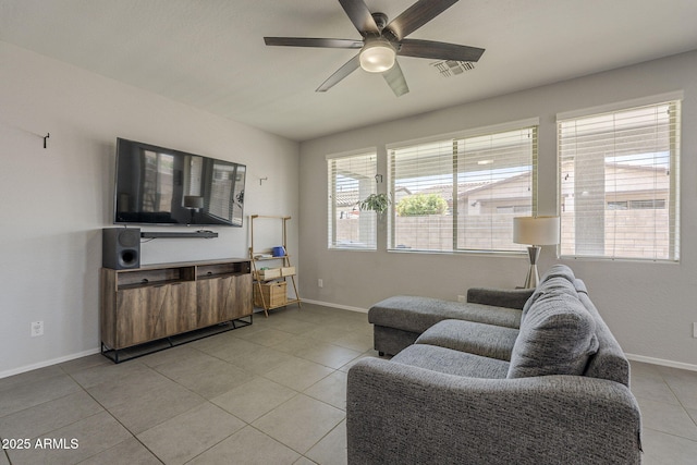 22463 E Desert Spoon Dr, Queen Creek, AZ 85142 - living room with light tile patterned floors, ceiling fan, and baseboards