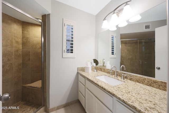 16108 E Emerald Dr Unit 106, Fountain Hills, AZ 85268 - bathroom featuring vanity, a stall shower, and tile patterned flooring